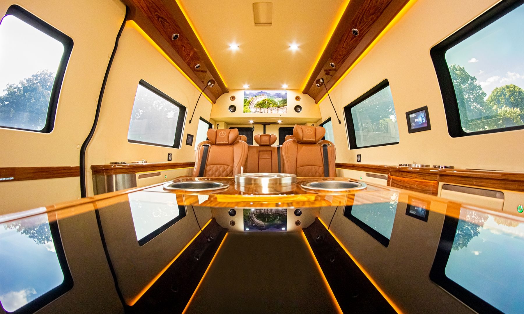 VIP Sprinter interior with the bar table and ambient lighting