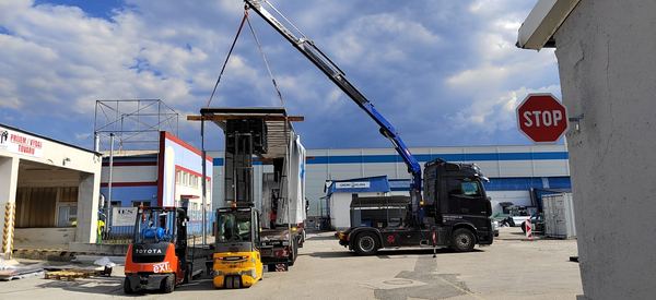 Assembling a trailer by crane on site in Žilina